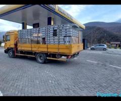Transport me kamjon dhe kamjonçine me vinç